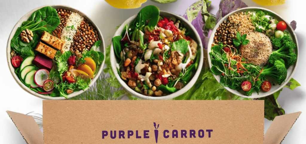 Purple Carrot Meal Plan Delivery Service showing an open box with some sample prepared meals above. Part of our list of Best Plant-Based Meal Prep Kits.