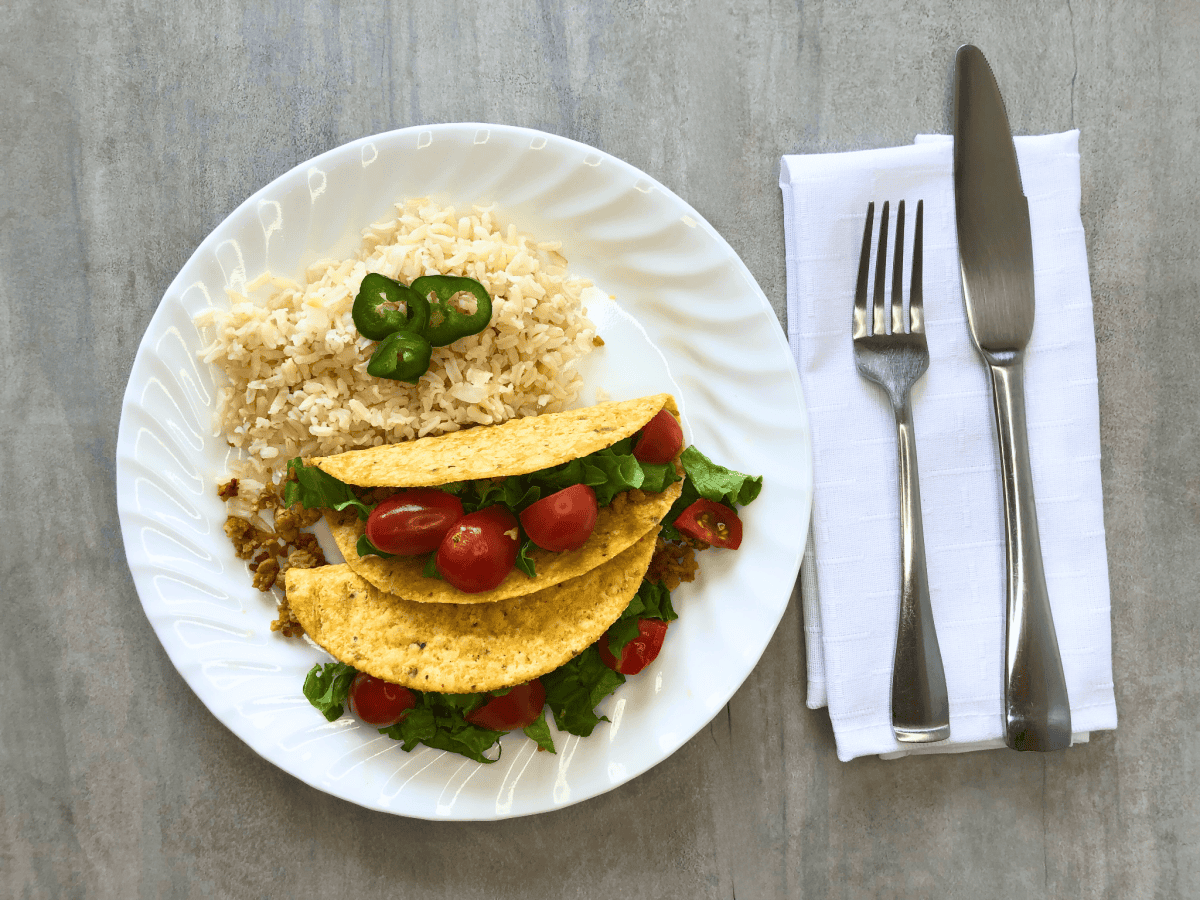 plated vegan seitan tacos with brown rice